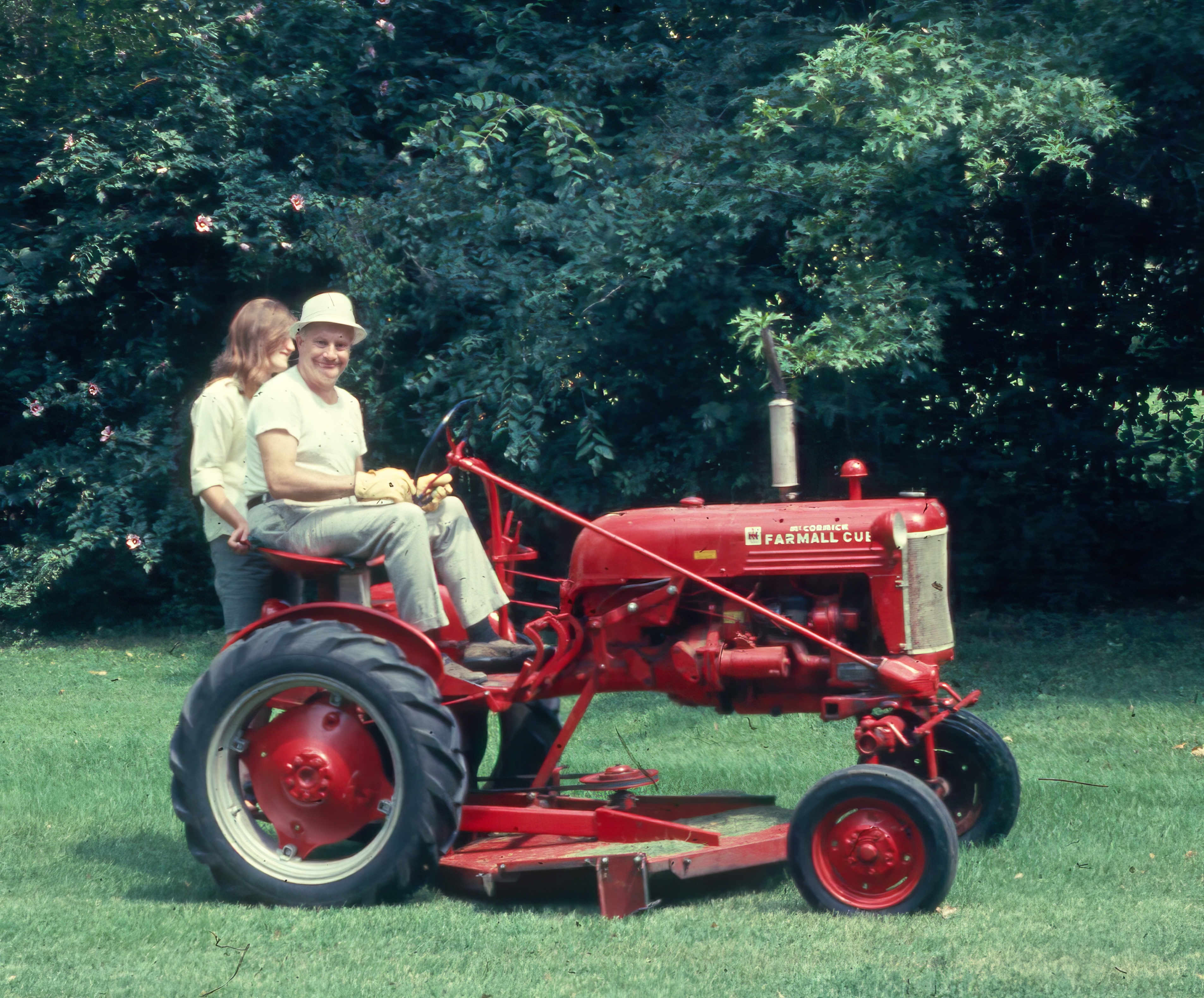Kathy and Art on the lawn tractor